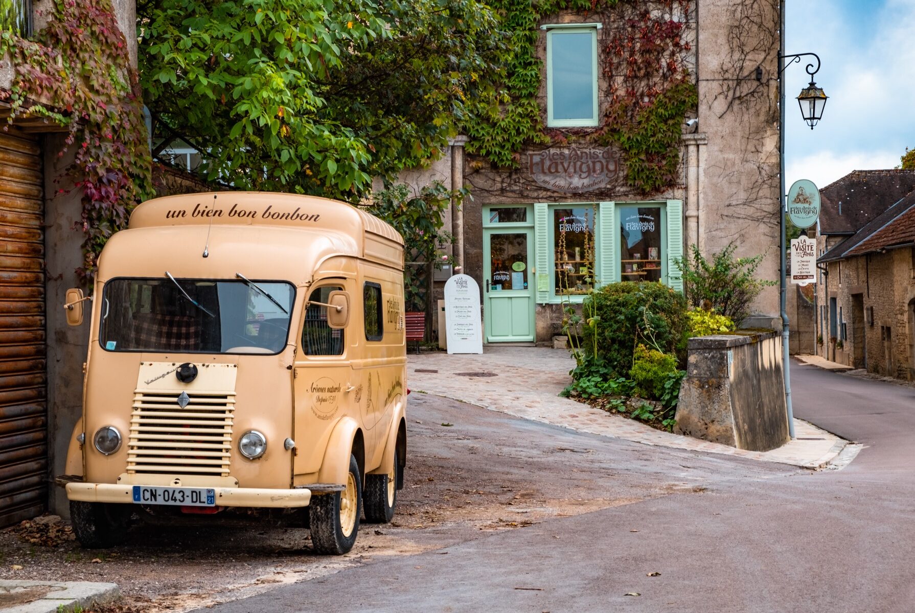 Flavigny sur Ozerain/ Burgundy/ France - 05.10.2019: Flavigny sur Ozerain. Little town in Burgundy, France. On the front line is candy truck "Les Anis de Flavigny" which carries that makes in Flavigny